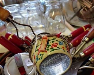 This little Floral enamel strainer still has the red and white string hang tag you can barely see Japan