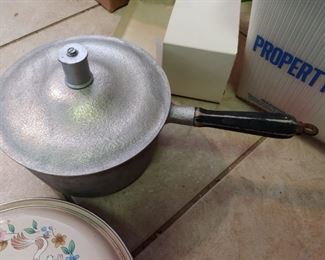 Vintage pots and pans and newer pots and pans tons of cookware