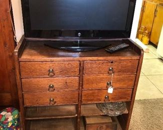 Love this little antique chest also flat screen TV