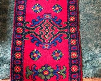 This hand latched rug has such vibrant color- 27” x 52”