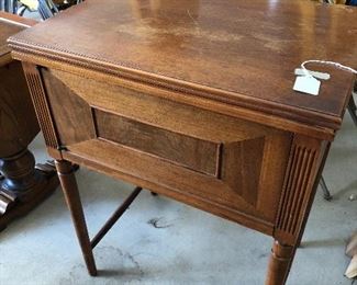 Antique sewing machine and cabinet