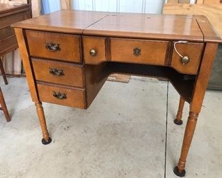 Antique sewing machine and cabinet