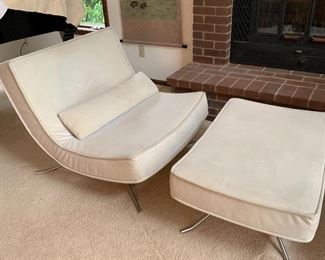 Pair of Ligne Roset POP chairs with matching ottoman. The Ligne Roset POP chair is a design that interprets the simplest shape, the curve. The deep, upholstered Butler seat ensures outstanding comfort, balanced on a stationery steel frame. 35.5”W x37.5”D x32”H