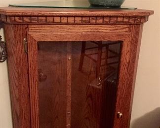 Corner cabinet with glass shelves