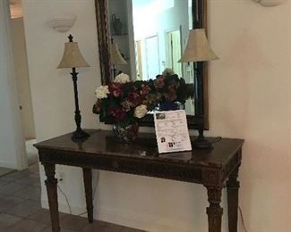 Sofa table , mirror, buffet lamps and faux floral