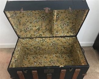 Interior of vintage camel back trunk