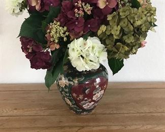 Faux floral in Asian style container