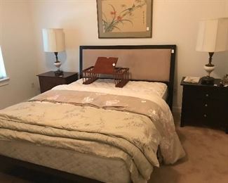 Queen platform bed shown with pristine mattress.