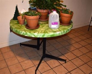 A table for the patio of porch area. The green & white is a  fitted table cover.