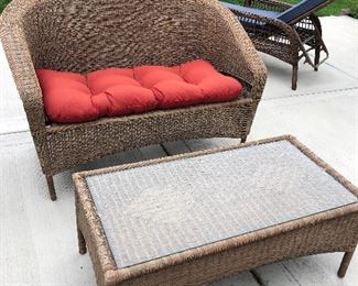 Wicker loveseat and coffee table