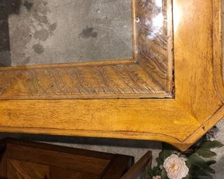Carved wooden coffee table with glass top