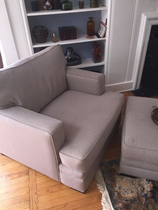 Pair of club chairs with ottomans