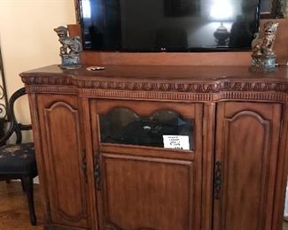 TV cabinet.  The TV slips down into the cabinet at the touch of a button.