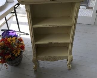 Unusual shelving unit .  Works great in small spaces but has lots of storage capabilities.  