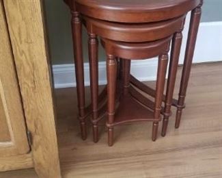 stackable wooden tables. 3 tables 26" tall, 23" tall and 20" tall. Largest one is 21" round