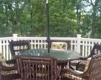 Patio set with umbrella and all chair cushions, pristine condition.