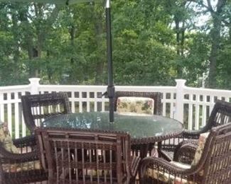 Patio set with umbrella and all chair cushions, pristine condition. 