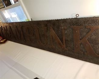 Very large metal steampunk sign