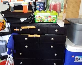 Black dresser, coolers, toy gun and more