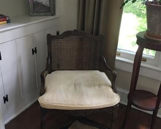 French wooden armchair, hole caning, with yellow striped cushion