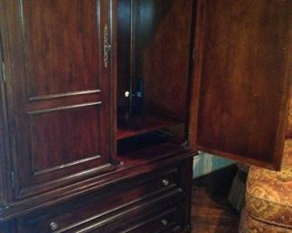 Handsome entertainment armoire provides great space.
