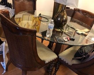 Glass Top Table and 4 Chairs, Table has small chip on side, priced to sell at $165 for the set