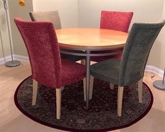Excellent, Round Dining Room table and 4 upholstered Parson's chairs.  Well built  also- round area rug