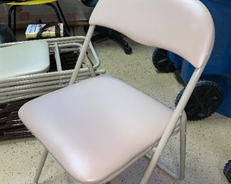 1 of many folding chairs w/cushion seats 