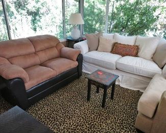Suede & Leather Loveseat; White Slip-Covered Loveseat; Large Cheetah-Pattern Carpet