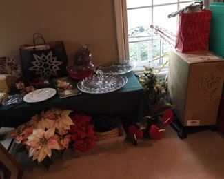Lots of Christmas decorations. Swivel tree stand. Table centerpieces. Serving platters. One regular tree stand (I think) that could also be used as a patio umbrella stand.