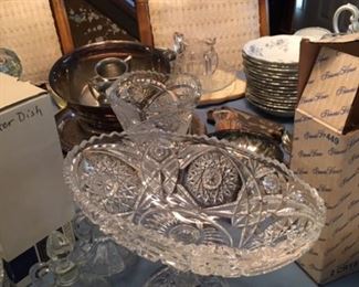 Cut glass footed fruit bowl and heavy vase. Several sets of cruets. Leaded crystal butter dish with cover and box. 
