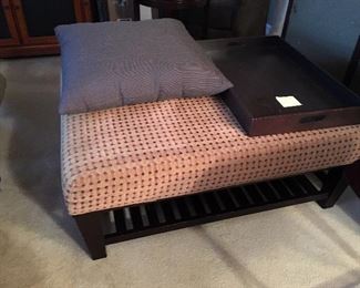 Large footrest/coffee table, in a pattern that sort of looks like bamboo in person, espresso wood tray.