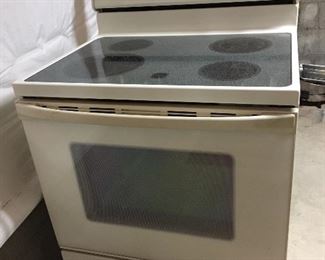 Whirlpool electric range, almond, self-cleaning oven, accu-bake, timed-bake, glasstop. $125. Lightly used (holidays). Now in basement here. You would need to move it.