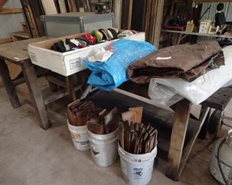 Work Tables. Tarps. Baseball Caps. Buckets of Wood Shingles. 