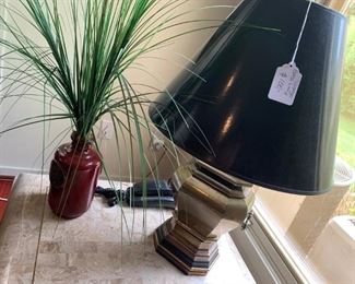 Lamp, side table, and small planter.