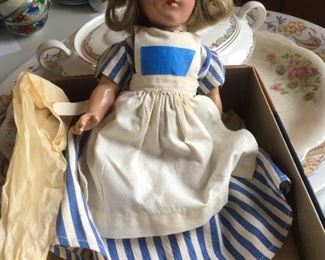 Very old all porcelain doll jointed and eyes work