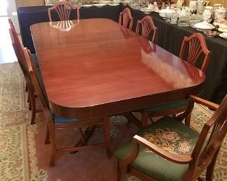 Duncan Phyfe style dining table with two leaves and 8 chairs.