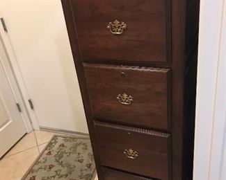 Nice solid wood four drawer file cabinet. Standard file width.