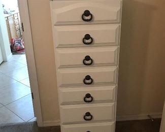 Tall white chest of drawers 53 1/2 tall by 20 inches wide.