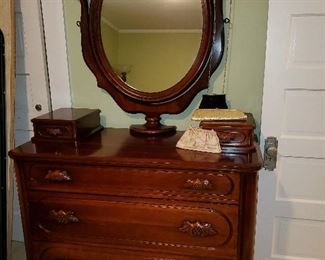NOT an antique, but the retail USED price for this chest with glove drawers and mirror is $1349. We are pricing it much less than that.