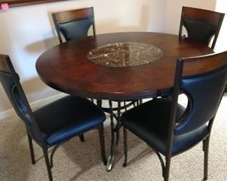 Reddish Stained Wood Table with Lazy Susan and Four Matching Chairs