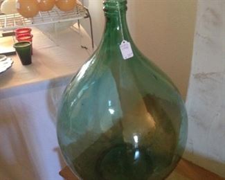 Vintage green demijohn wine jug