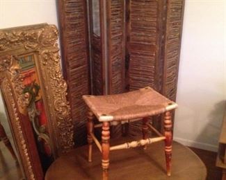 Five-panel twig room divider; Mid Century oval table; small rush seat stool