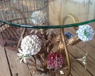 Metal flower base table with glass top
