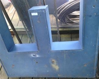 Metal letter:  "W"?  "M"?  "E"?