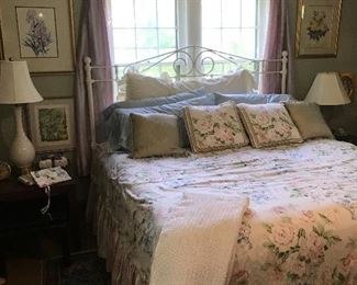 The bedroom, the king size bed is sold as it sits, dressed in new sheets and a costume made spread and shams. All for one price and priced to sell! 
