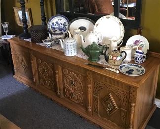 An American oak dining room side board 
on top a collection of tea pots 