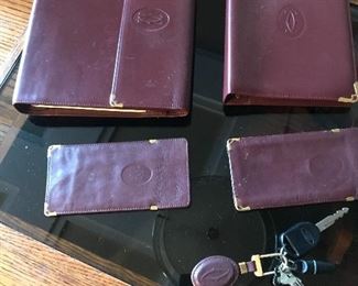 Vintage Cartier address book, travel organizer, two eye glass covers and a key ring 