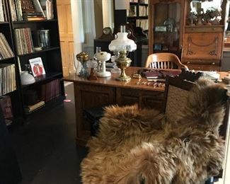 The office is filled with books antique records, oil lamps, clocks, music and much more. Don’t miss the real bear rug laying on the chair in front of the desk!!