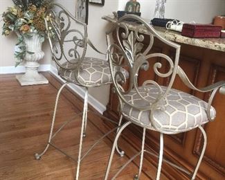 Several pairs of bar stools.